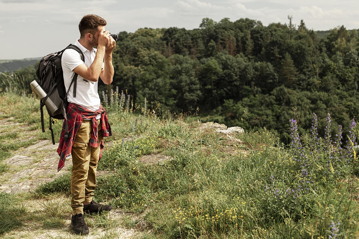 side-view-man-taking-photos-min